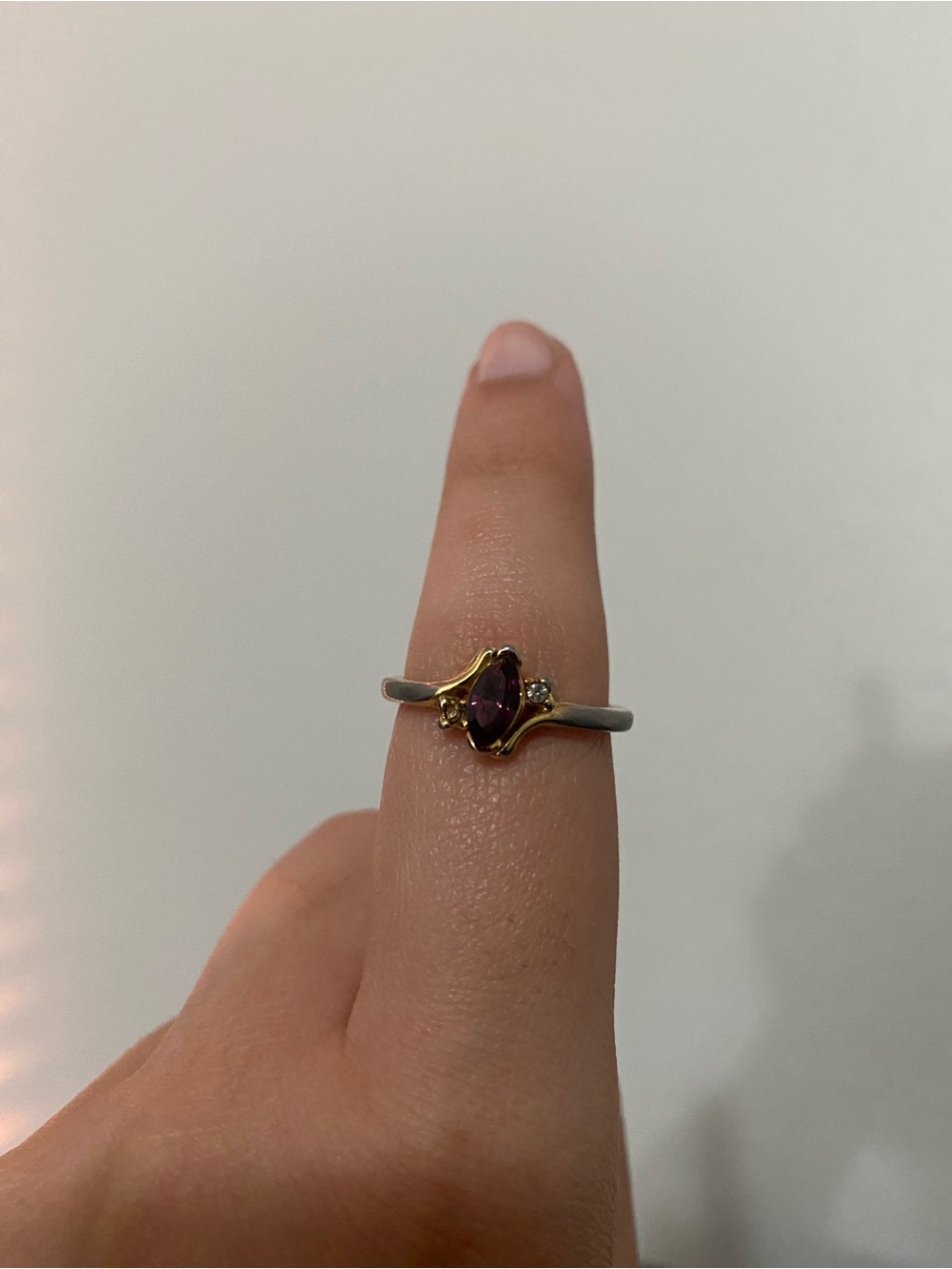 gold tone ring with purple stone